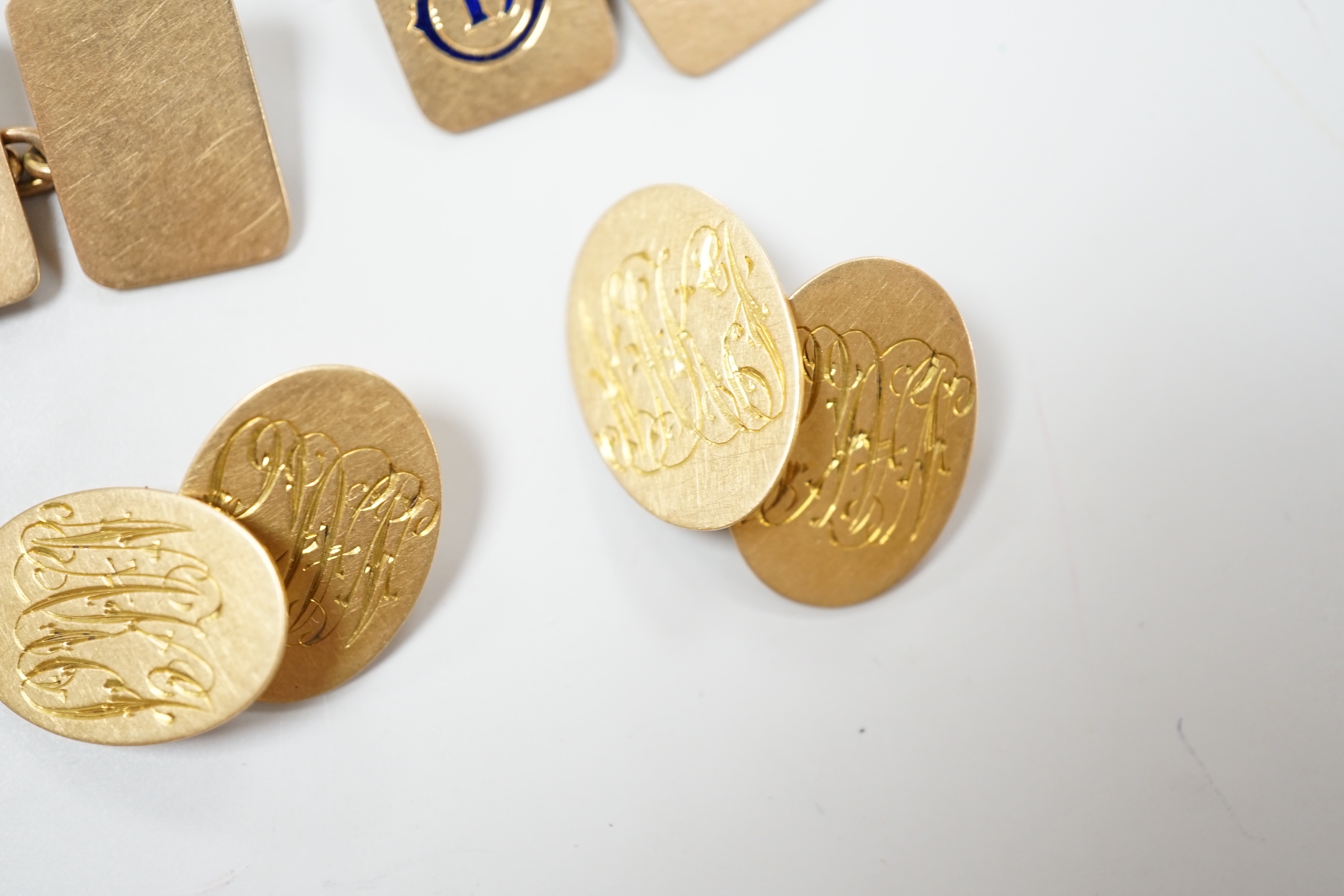 A pair of 18ct gold rectangular cufflinks, with enamelled initial N, 8.2 grams, and a pair of 18ct gold monogrammed oval cufflinks, 8 grams